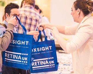 Woman handing out delegate bags