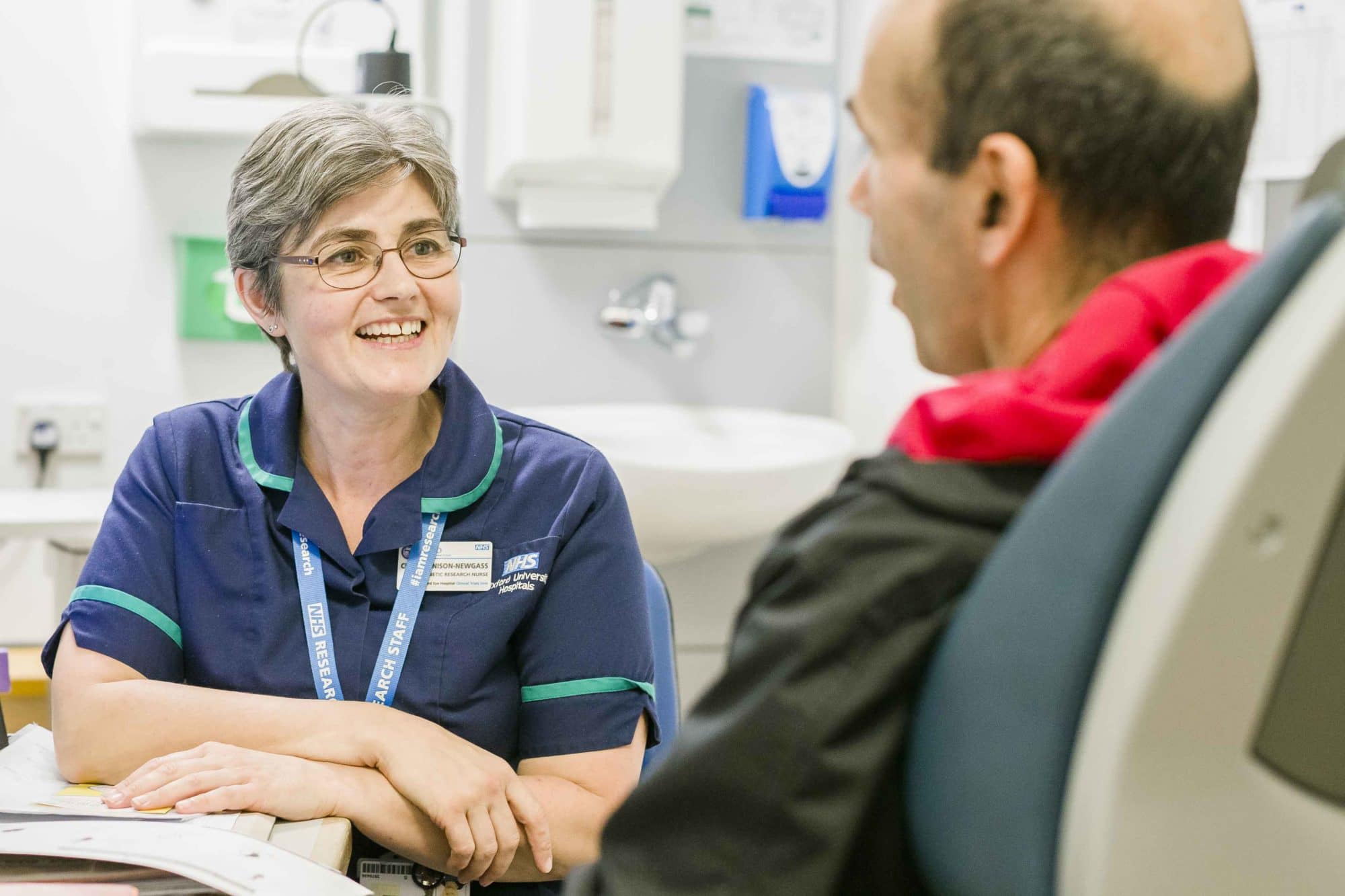 Nurse chatting to man