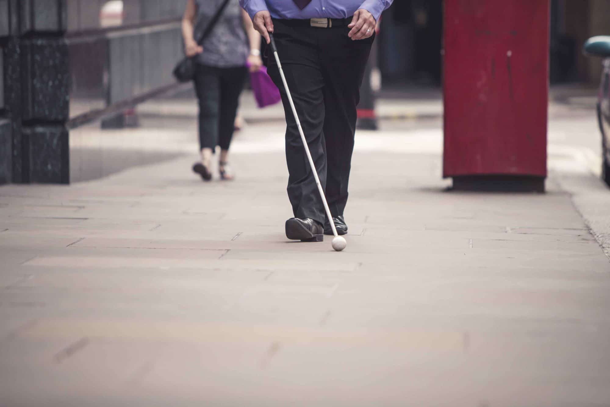 man walking with cane