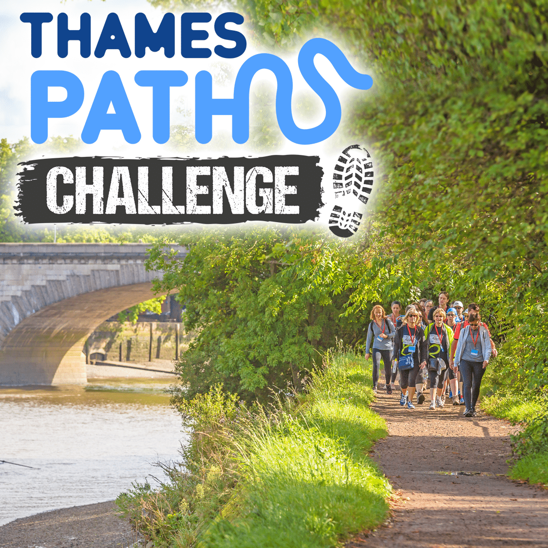 Image shows a group of walkers walking along a path with the Thames to the left and a hedgerow to the right. A bridge can be seen in the background. 'Thames Path Challenge' is written on the top left.