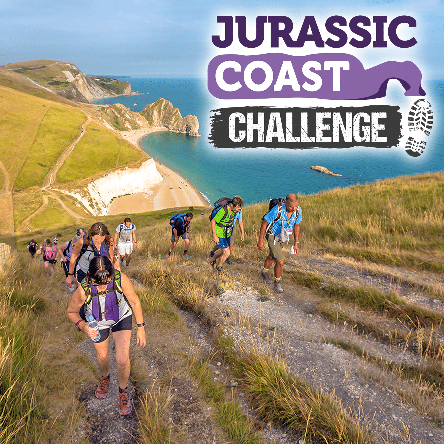 Image shows a group of walkers walking along a coastal path. White cliffs and Durdle Door are visible in the background. 'Jurassic Coast Challenge' is written on the top right of the image.