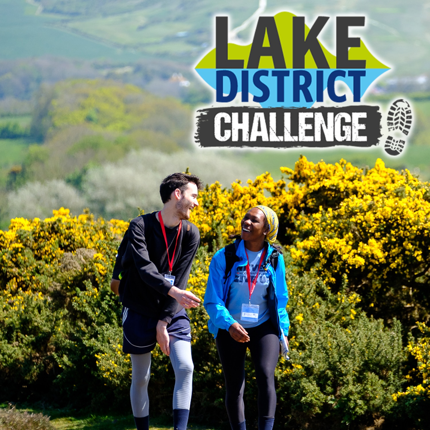 Image shows two walkers with yellow gorse in the background. 'Lake District Challenge' is written on the top right of the image.