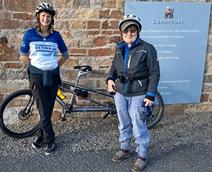 Maddie and Isobel with a tandem bicycle