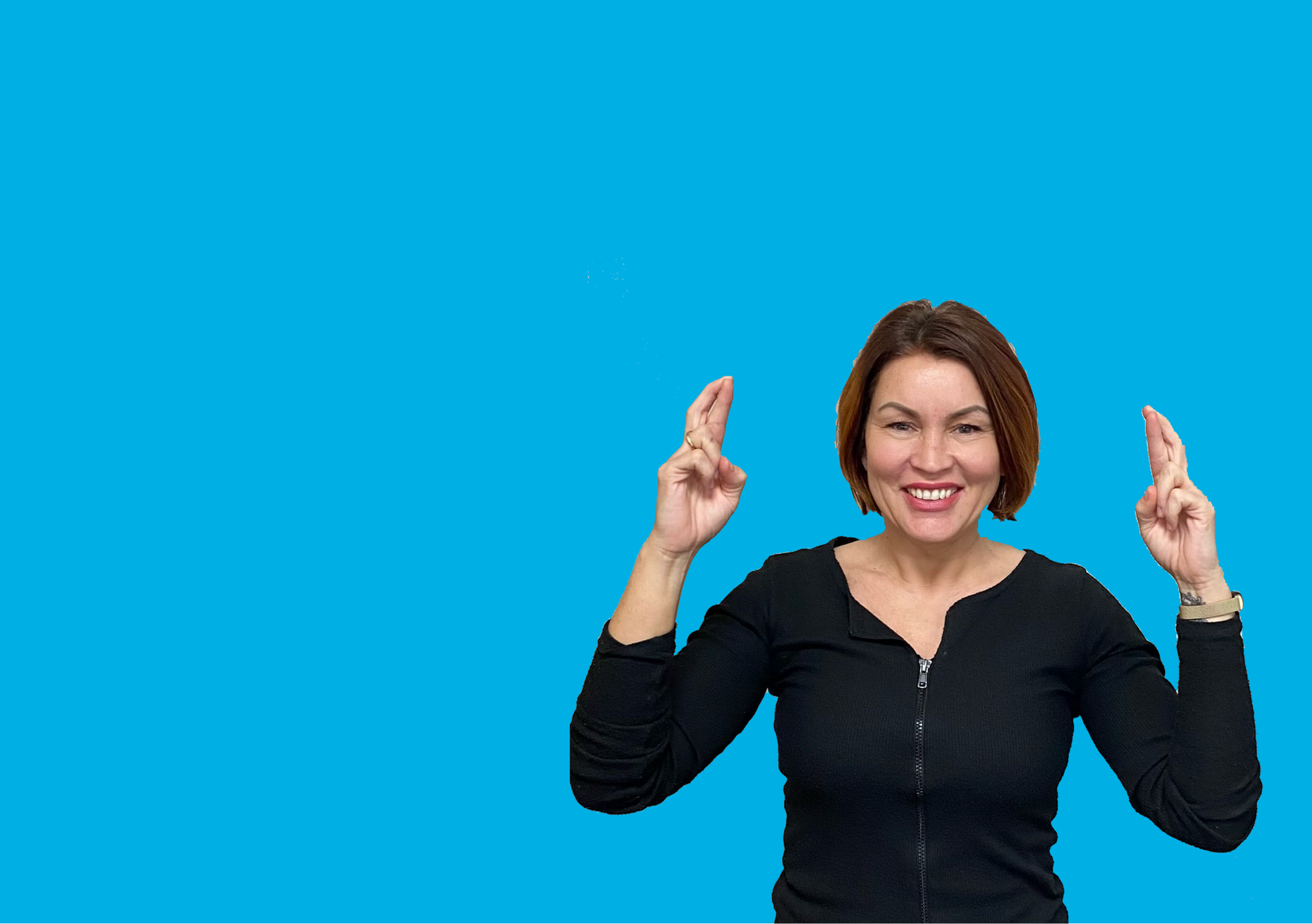 A woman with her fingers crossed on a light blue background