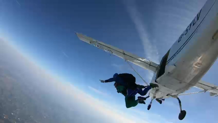 A lady begins her skydive.