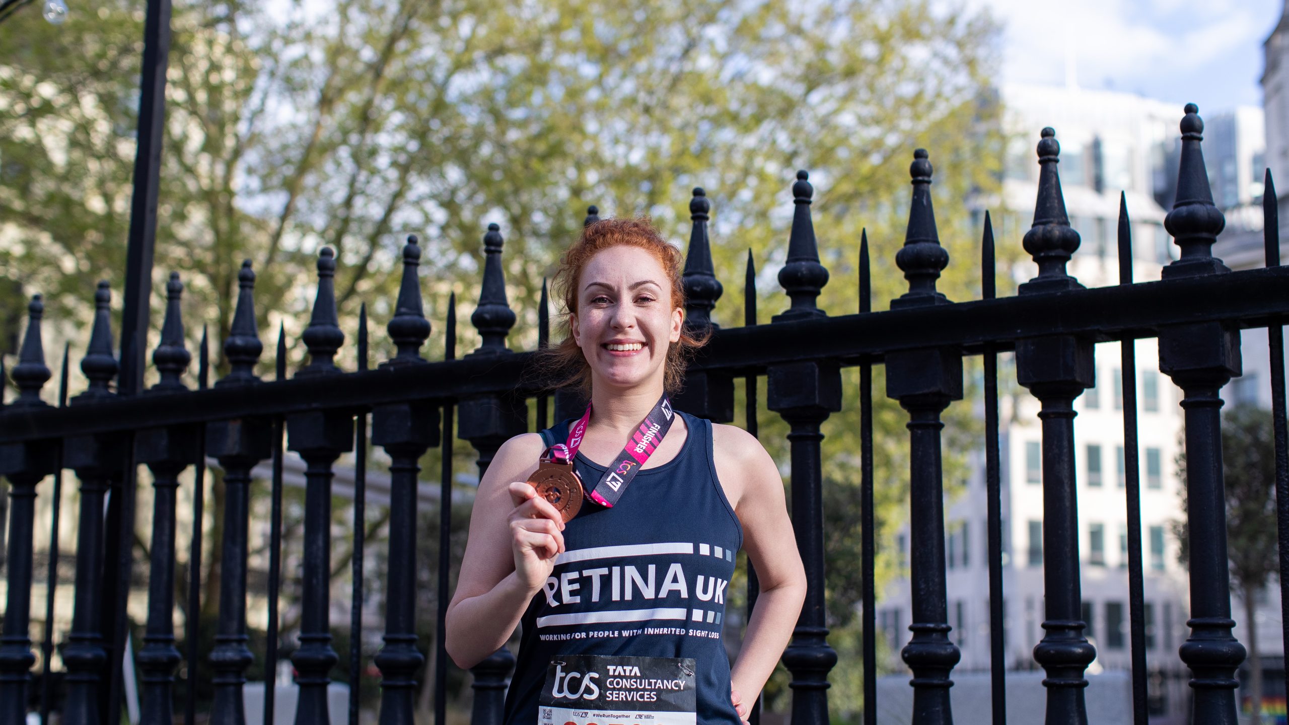 A smiling female runner at the London Marathon.