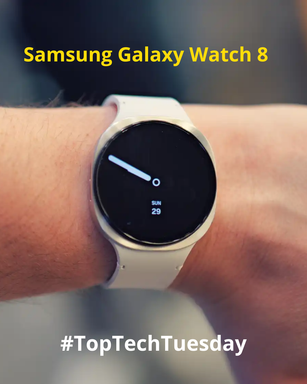 A close-up of a person wearing a white Samsung Galaxy Watch 8 on their wrist. The smartwatch has a round black display showing the time with a minimalistic white hand and the date 