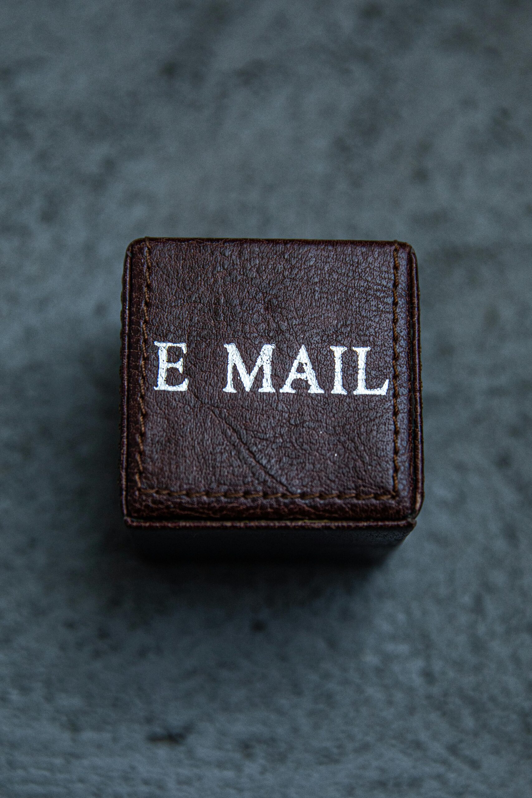Email written in capital letters on a small brown box